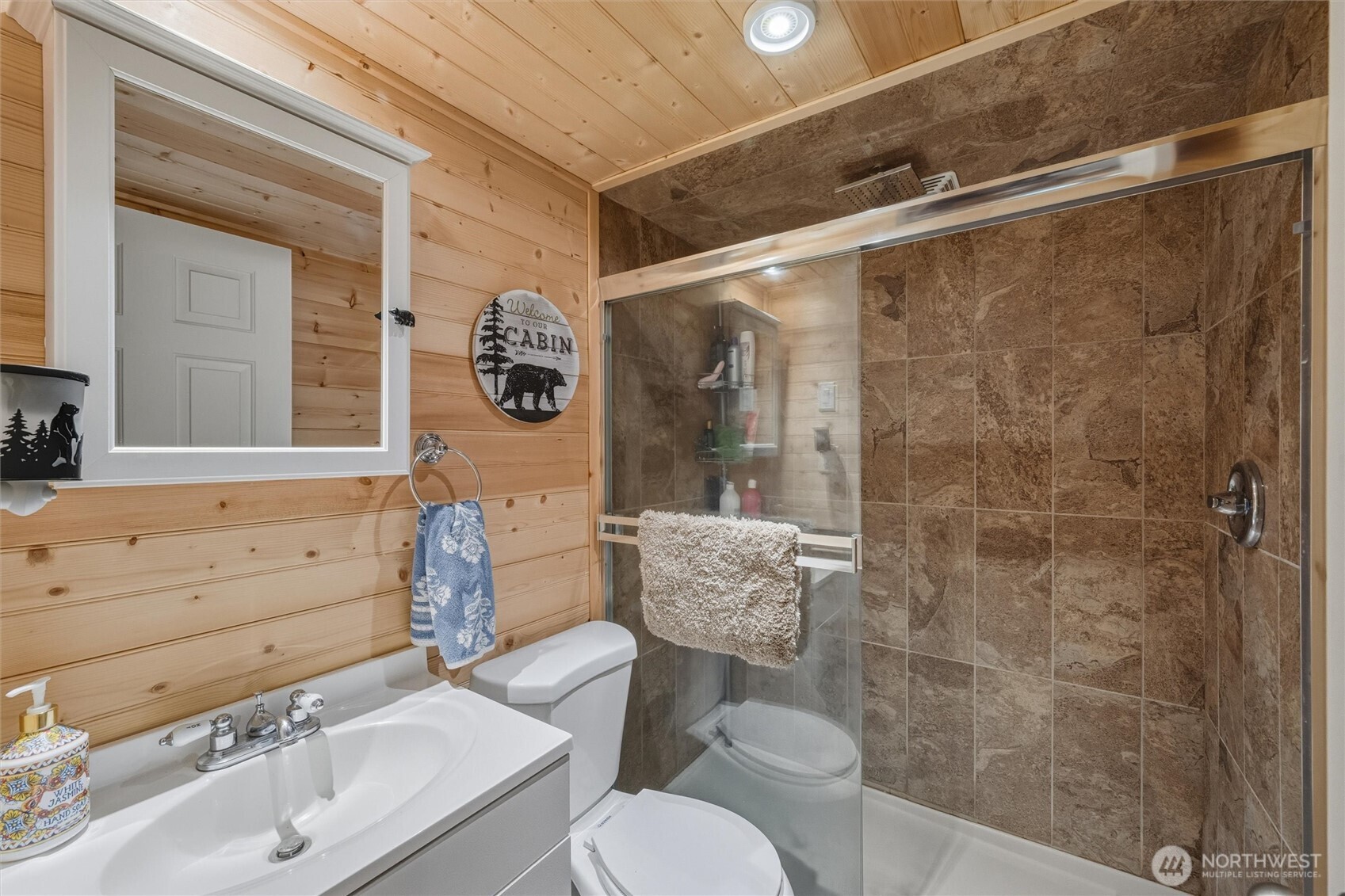 1015 Maple Lane Maple Falls, WA 98266 - Photo 13 of 39 a bathroom with a sink mirror and a shower