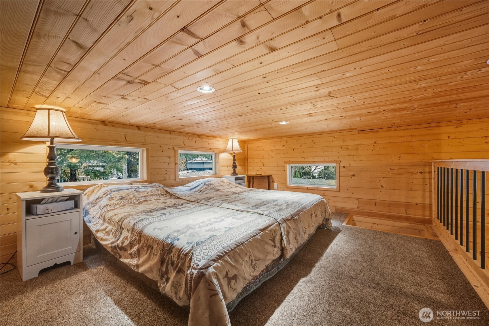 1015 Maple Lane Maple Falls, WA 98266 - Photo 22 of 39 a bed sitting in a spacious bedroom next to a larger window