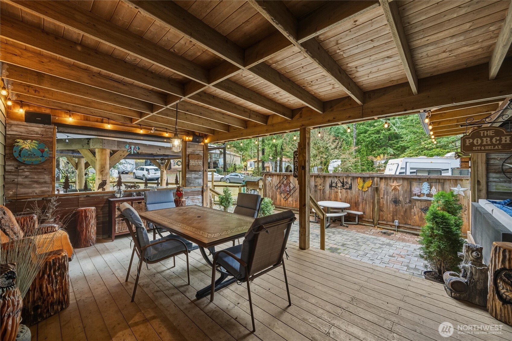 1015 Maple Lane Maple Falls, WA 98266 - Photo 30 of 39 a view of a backyard with a dining space and wooden floor