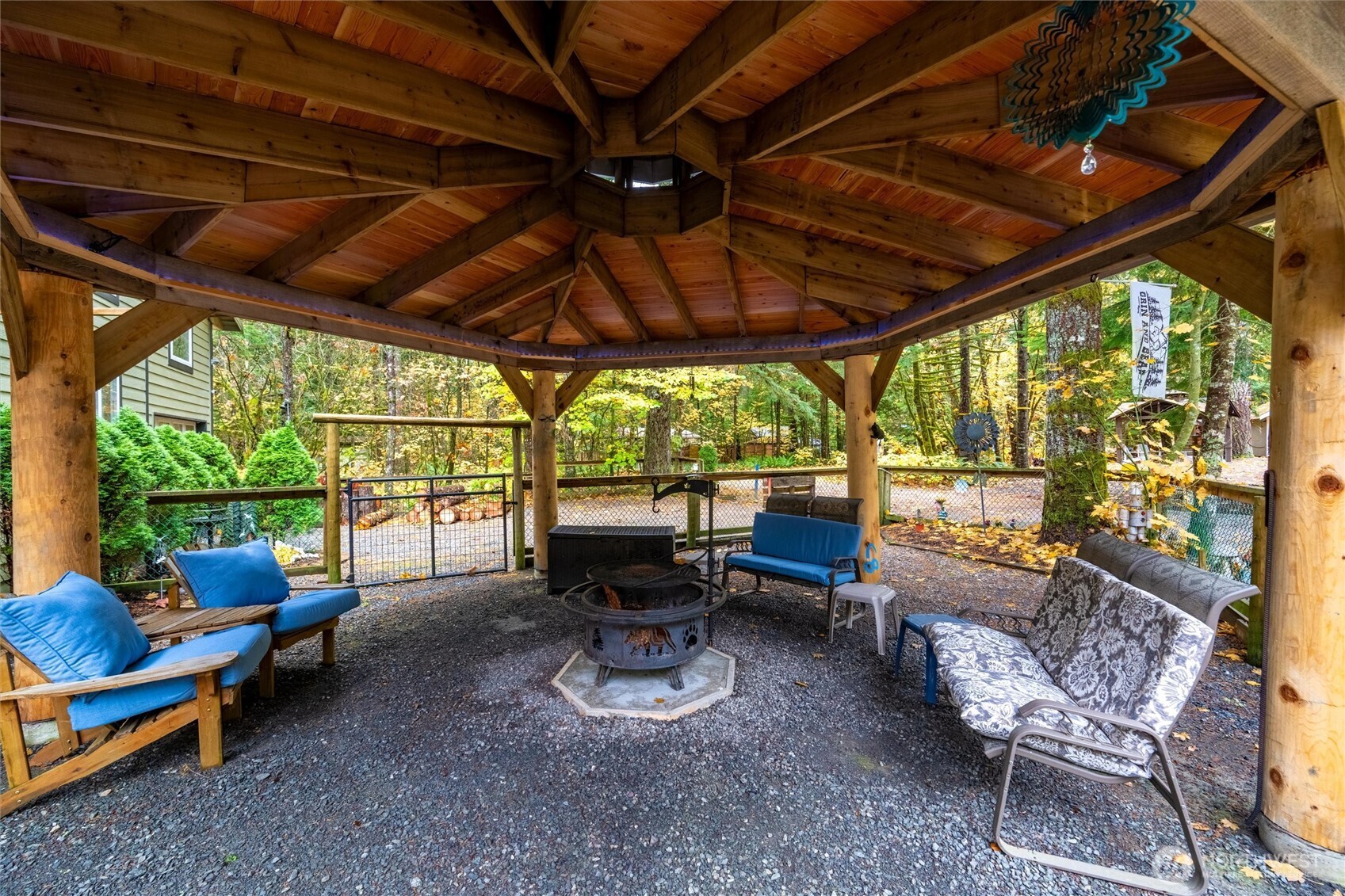 1015 Maple Lane Maple Falls, WA 98266 - Photo 33 of 39 a view of a patio with table and chairs under an umbrella with a patio