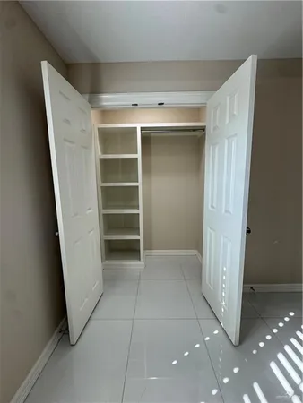 a view of an empty room and window