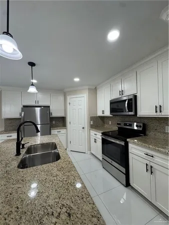 a kitchen with a sink and cabinets