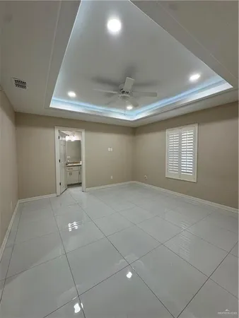 a bathroom with a granite countertop sink a toilet and a shower