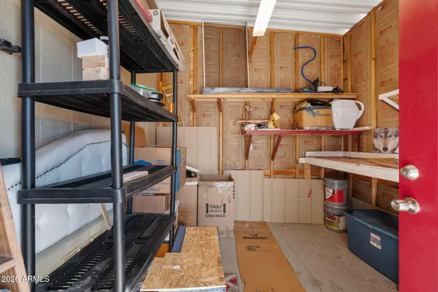 a view of a house with backyard porch and sitting area