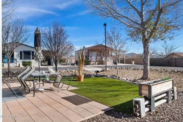 a front view of a building with a parked car