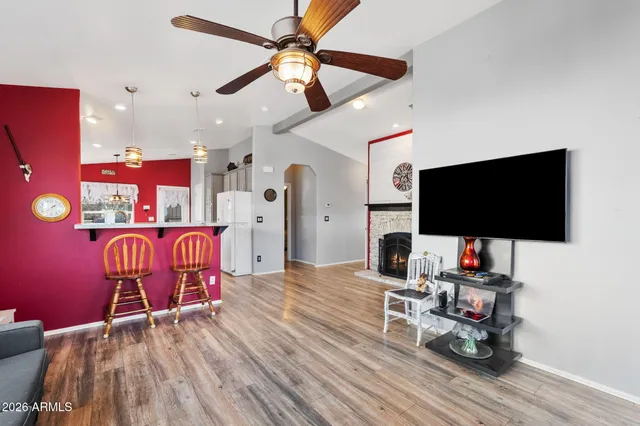 a living room with furniture and a flat screen tv