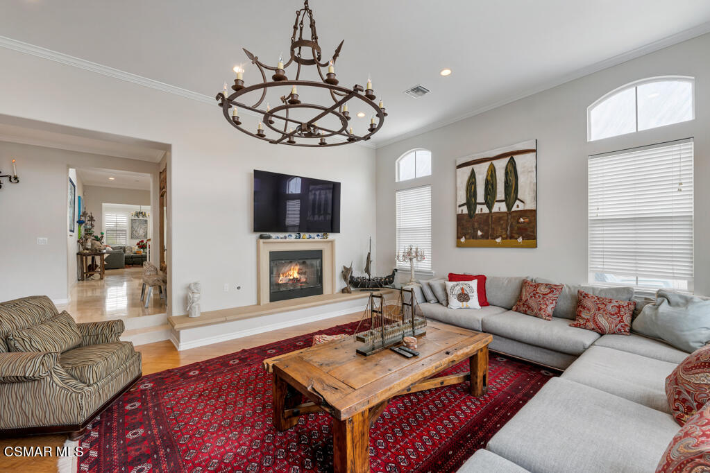 1410 Viewpoint Drive Oxnard, CA 93035 - Photo 16 of 73 a living room with furniture a fireplace and a flat screen tv