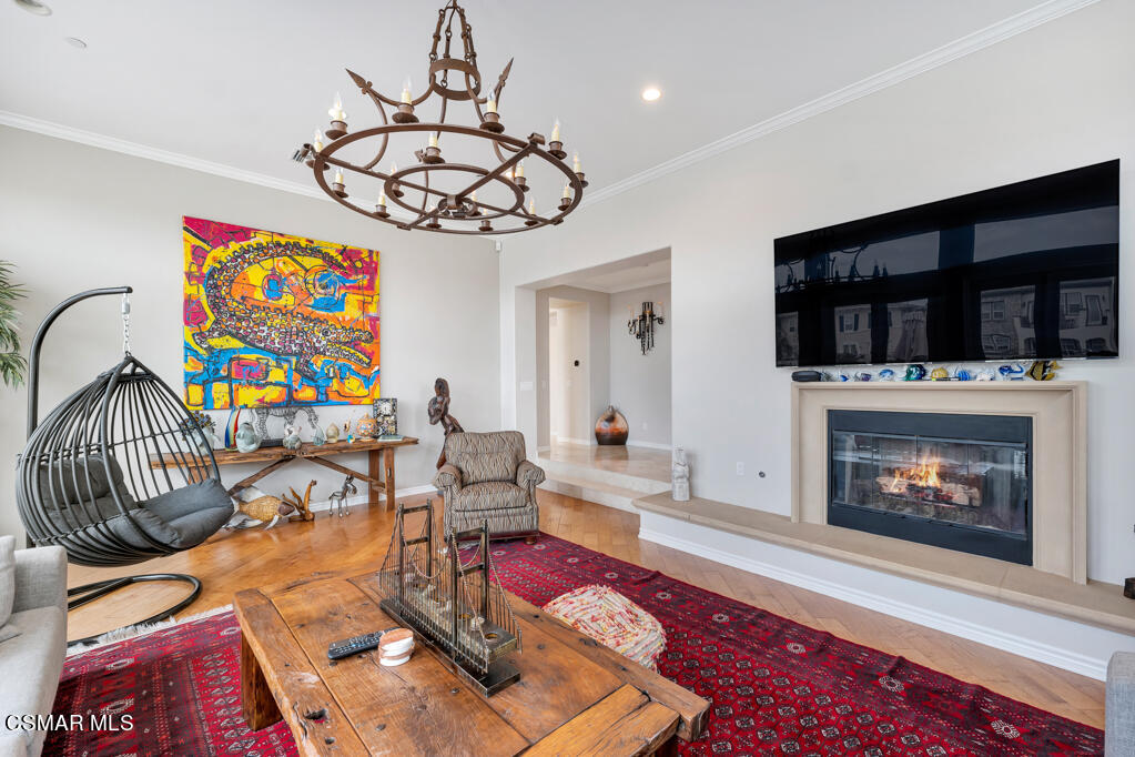 1410 Viewpoint Drive Oxnard, CA 93035 - Photo 17 of 73 a living room with furniture a dining table and a fireplace