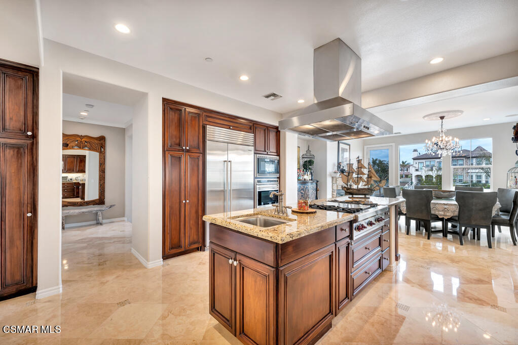 1410 Viewpoint Drive Oxnard, CA 93035 - Photo 19 of 73 a large kitchen with stainless steel appliances granite countertop a large counter top a stove and a refrigerator