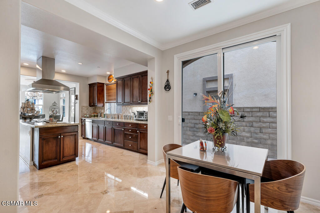 1410 Viewpoint Drive Oxnard, CA 93035 - Photo 26 of 73 a kitchen with stainless steel appliances granite countertop a sink and a refrigerator