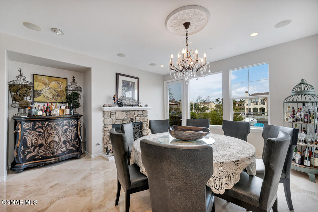1410 Viewpoint Drive Oxnard, CA 93035 - Photo 30 of 73 a dining room with furniture a chandelier and window