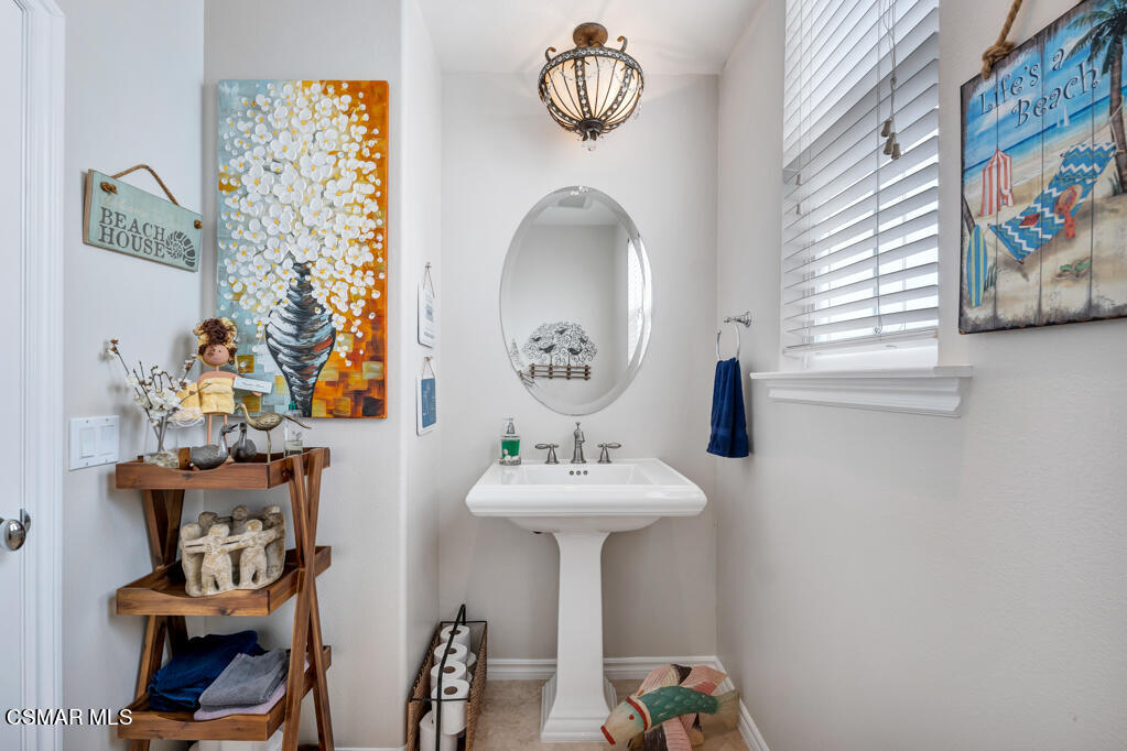 1410 Viewpoint Drive Oxnard, CA 93035 - Photo 31 of 73 a bathroom with a sink and a mirror