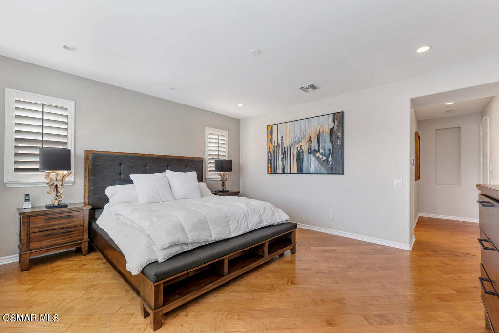1410 Viewpoint Drive Oxnard, CA 93035 - Photo 34 of 73 a spacious bedroom with a bed and a painting on the wall