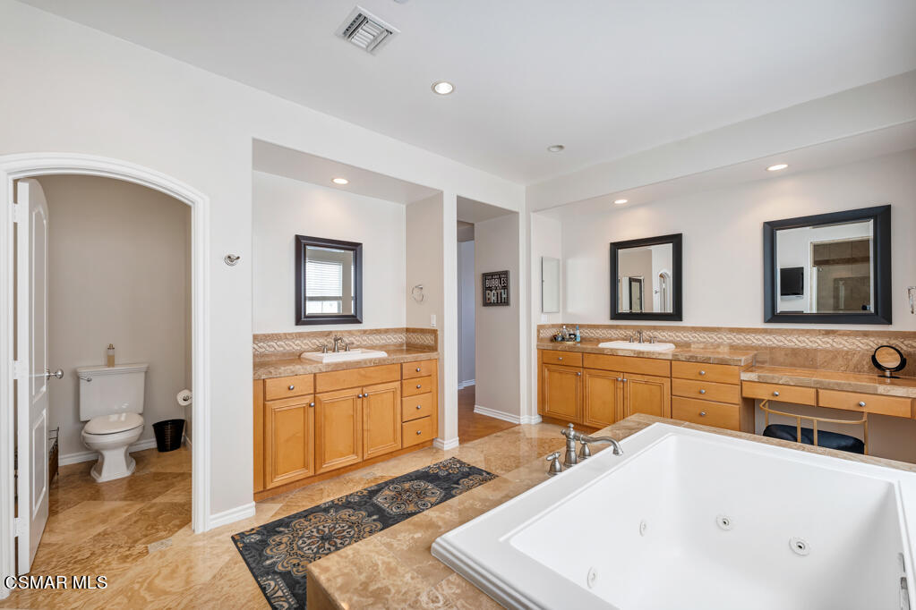 1410 Viewpoint Drive Oxnard, CA 93035 - Photo 35 of 73 a large spacious bathroom with a tub sink and mirror