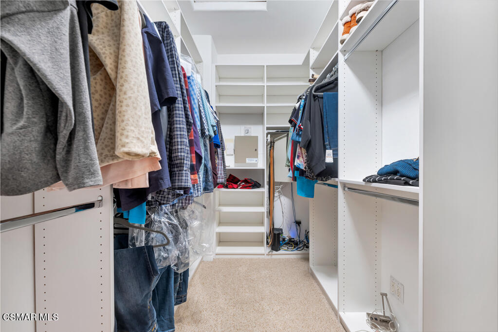 1410 Viewpoint Drive Oxnard, CA 93035 - Photo 39 of 73 a view of walk in closet with clothes and shoes