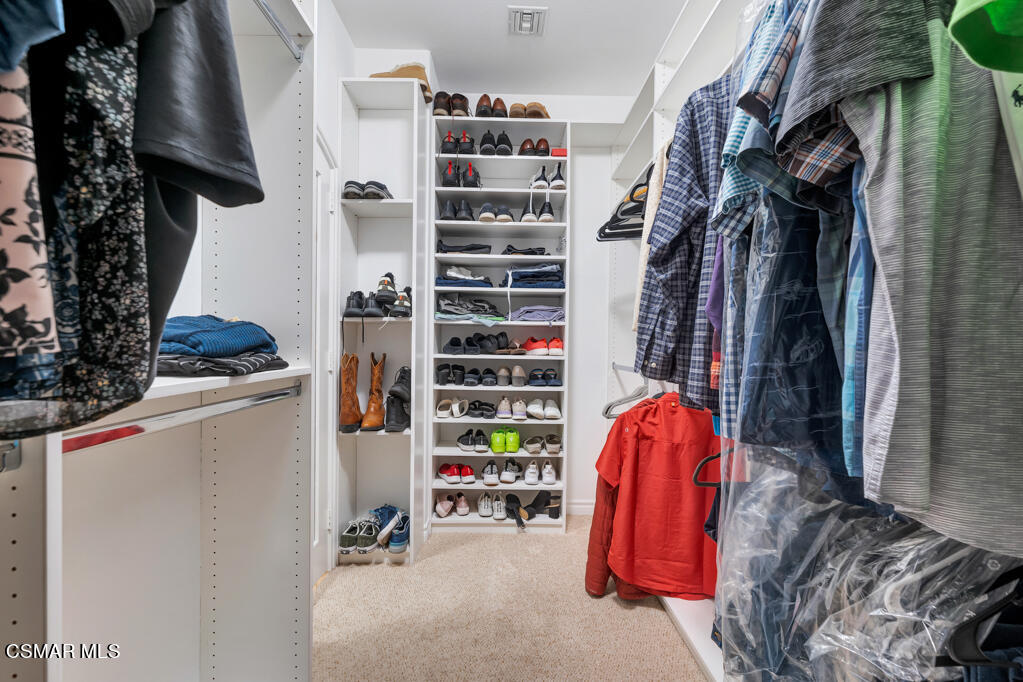 1410 Viewpoint Drive Oxnard, CA 93035 - Photo 40 of 73 a view of walk in closet with clothes and shoes