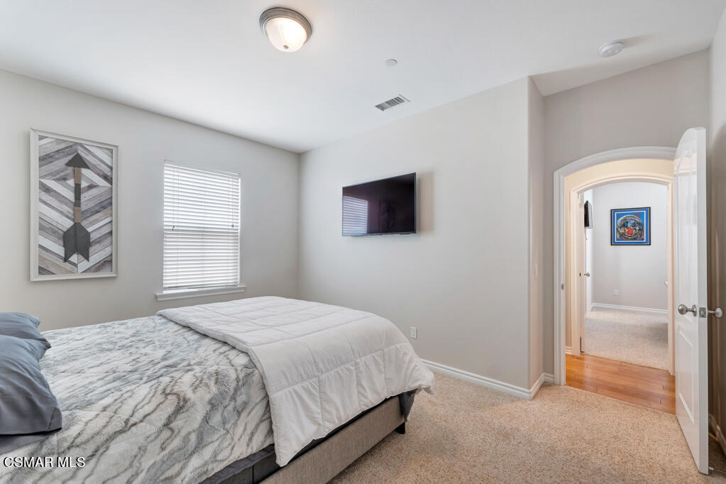 1410 Viewpoint Drive Oxnard, CA 93035 - Photo 43 of 73 a bedroom with a bed and a painting on the wall