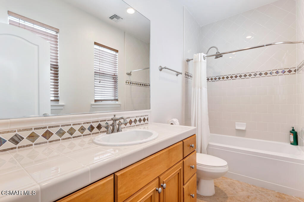 1410 Viewpoint Drive Oxnard, CA 93035 - Photo 49 of 73 a bathroom with a sink a toilet a mirror a bathtub and shower