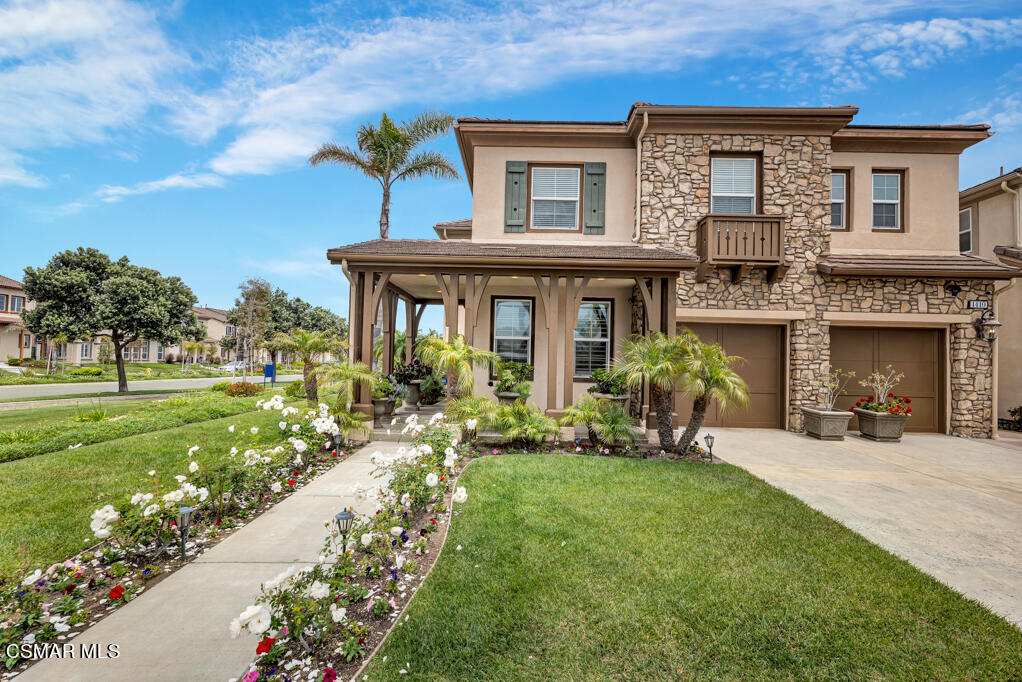 1410 Viewpoint Drive Oxnard, CA 93035 - Photo 5 of 73 a front view of a house with a yard table and chairs