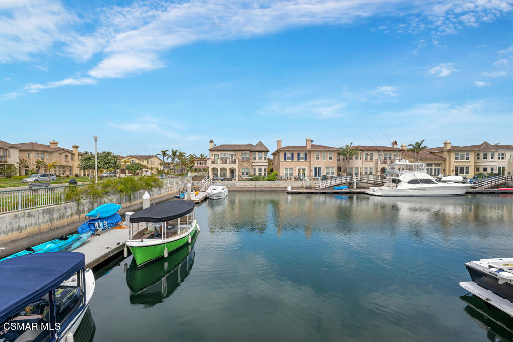 1410 Viewpoint Drive Oxnard, CA 93035 - Photo 63 of 73 a view of a lake with a table and chairs
