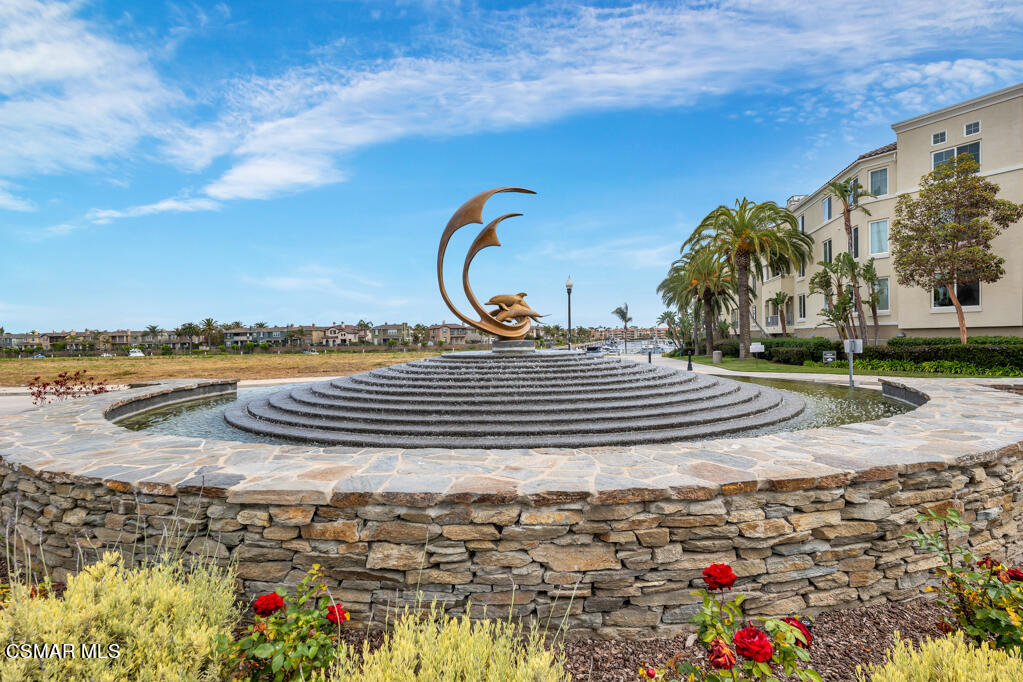 1410 Viewpoint Drive Oxnard, CA 93035 - Photo 73 of 73 a view of a swimming pool with a bench and some trees in the background