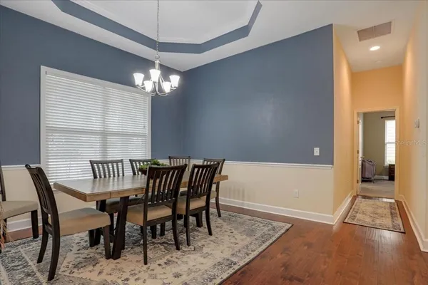 a view of a dining room with furniture window and outside view