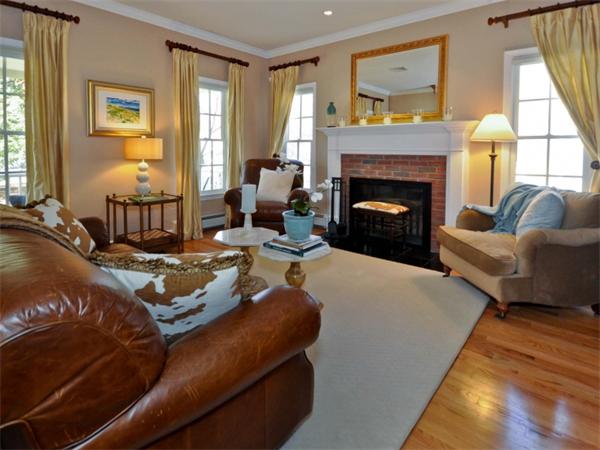 19 Colonial Road Needham, MA 02492 - Photo 12 of 30 a living room with furniture large window and a fireplace