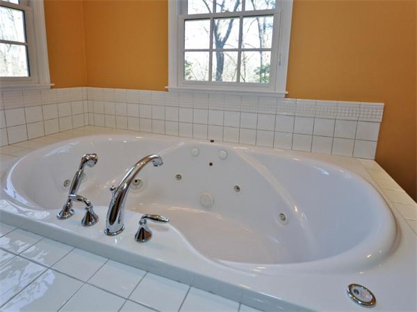 19 Colonial Road Needham, MA 02492 - Photo 15 of 30 a bathroom with bathtub