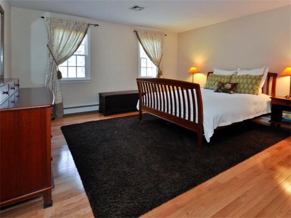 19 Colonial Road Needham, MA 02492 - Photo 18 of 30 a bedroom with a bed and window