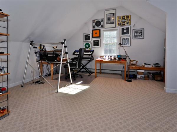19 Colonial Road Needham, MA 02492 - Photo 20 of 30 a room with gym equipment and a table