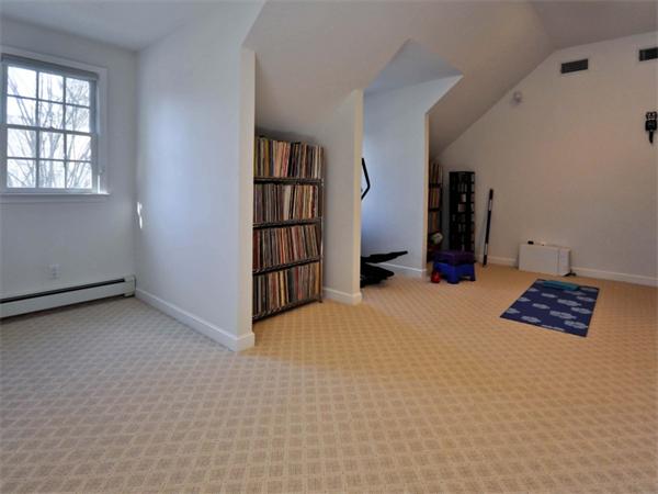 19 Colonial Road Needham, MA 02492 - Photo 21 of 30 an empty room with bookshelf and a window