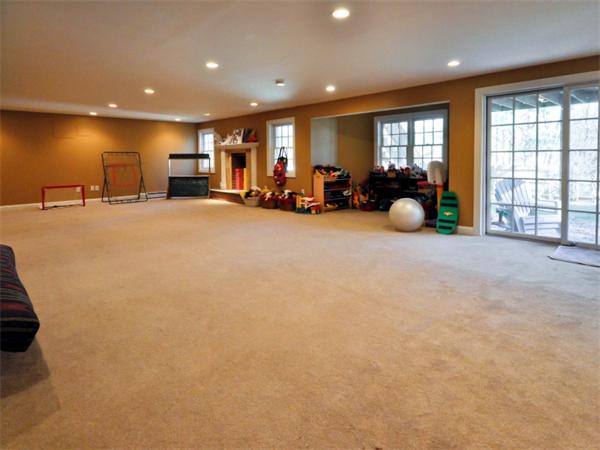 19 Colonial Road Needham, MA 02492 - Photo 22 of 30 a living room with furniture and a large window