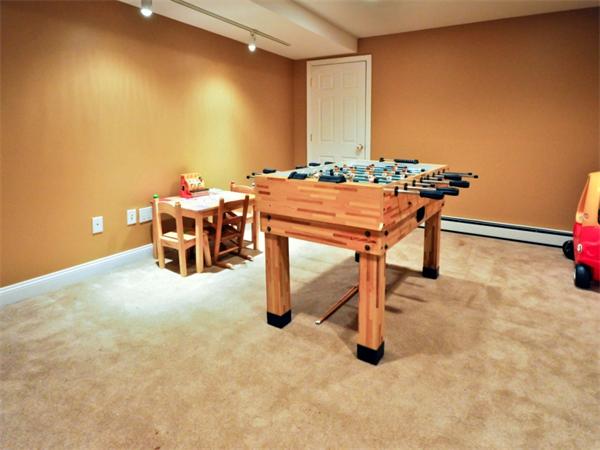 19 Colonial Road Needham, MA 02492 - Photo 24 of 30 a dining room with furniture and a potted plant