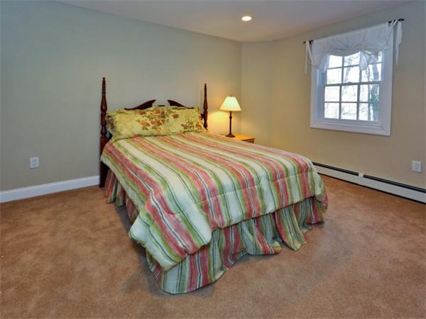 19 Colonial Road Needham, MA 02492 - Photo 26 of 30 a bedroom with a bed and a window