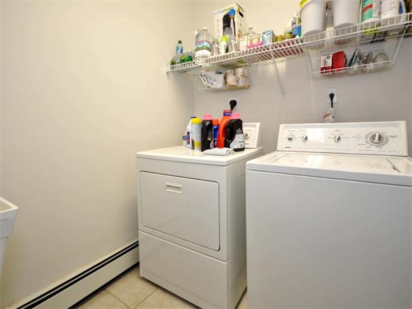 19 Colonial Road Needham, MA 02492 - Photo 27 of 30 a utility room with dryer and washer