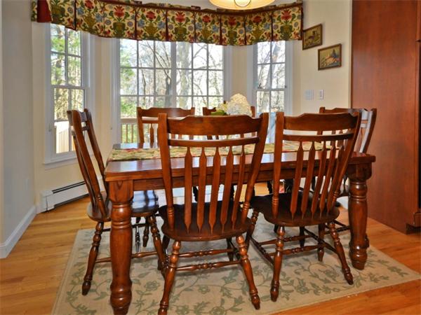 19 Colonial Road Needham, MA 02492 - Photo 7 of 30 a view of a dining room with furniture window and outside view