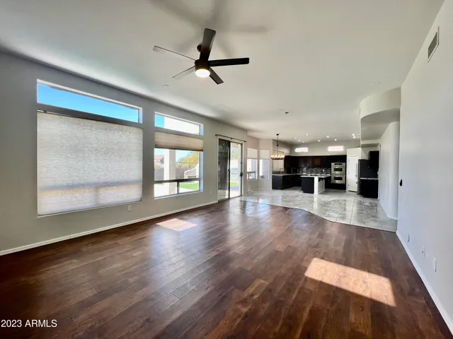 a view of a bathroom with mirror and bathtub