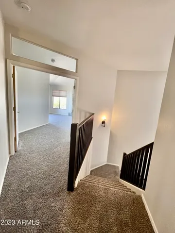 a view of room with a fireplace and a shower