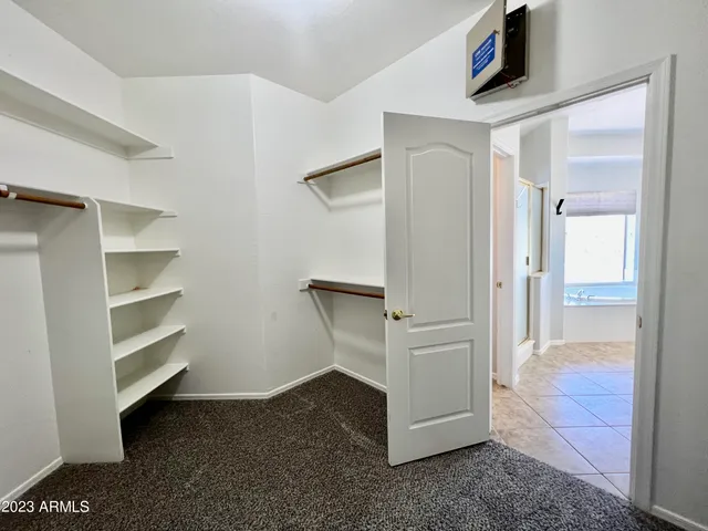 a view of empty room with ceiling fan