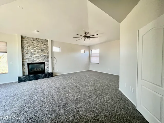 an empty room with a empty space and a ceiling fan