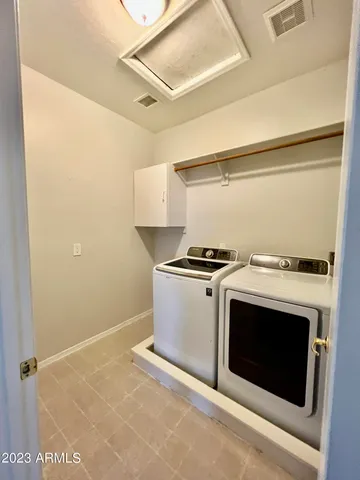 a view of a livingroom with a ceiling fan and window