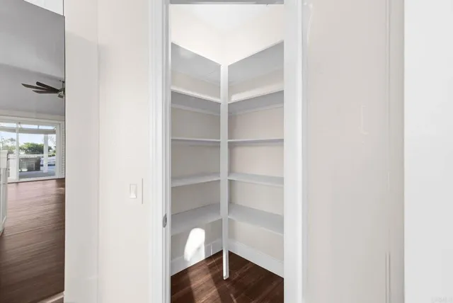 a view of a livingroom with furniture and a flat screen tv