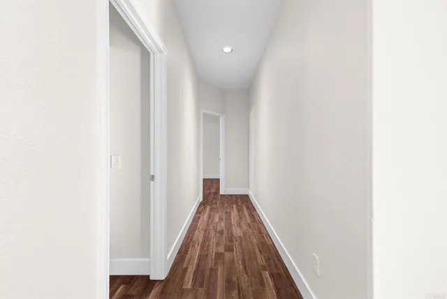 a bathroom with a granite countertop sink and mirror