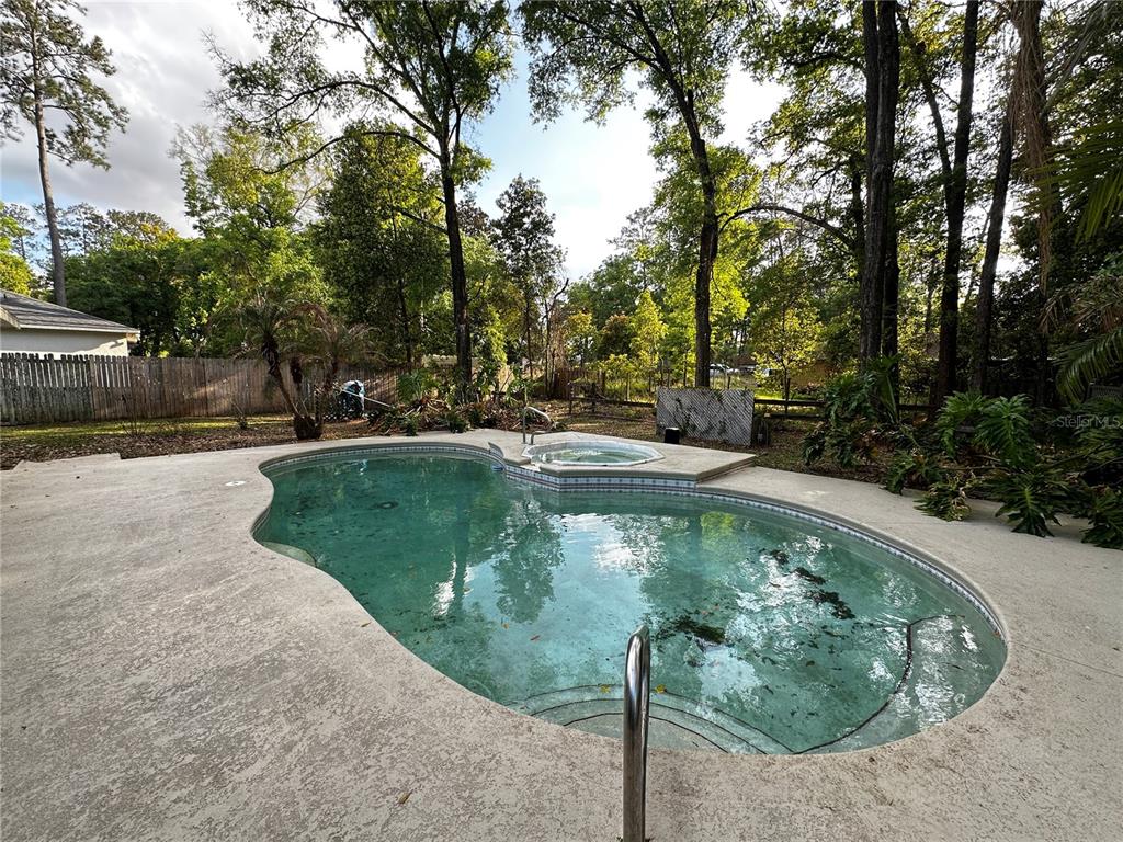 44 Teak Road Ocala, FL 34472 - Photo 12 of 12 a view of a water pond with green yard