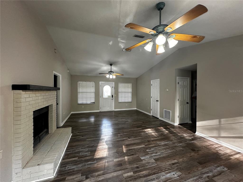 44 Teak Road Ocala, FL 34472 - Photo 2 of 12 a view of an empty room with window and fireplace