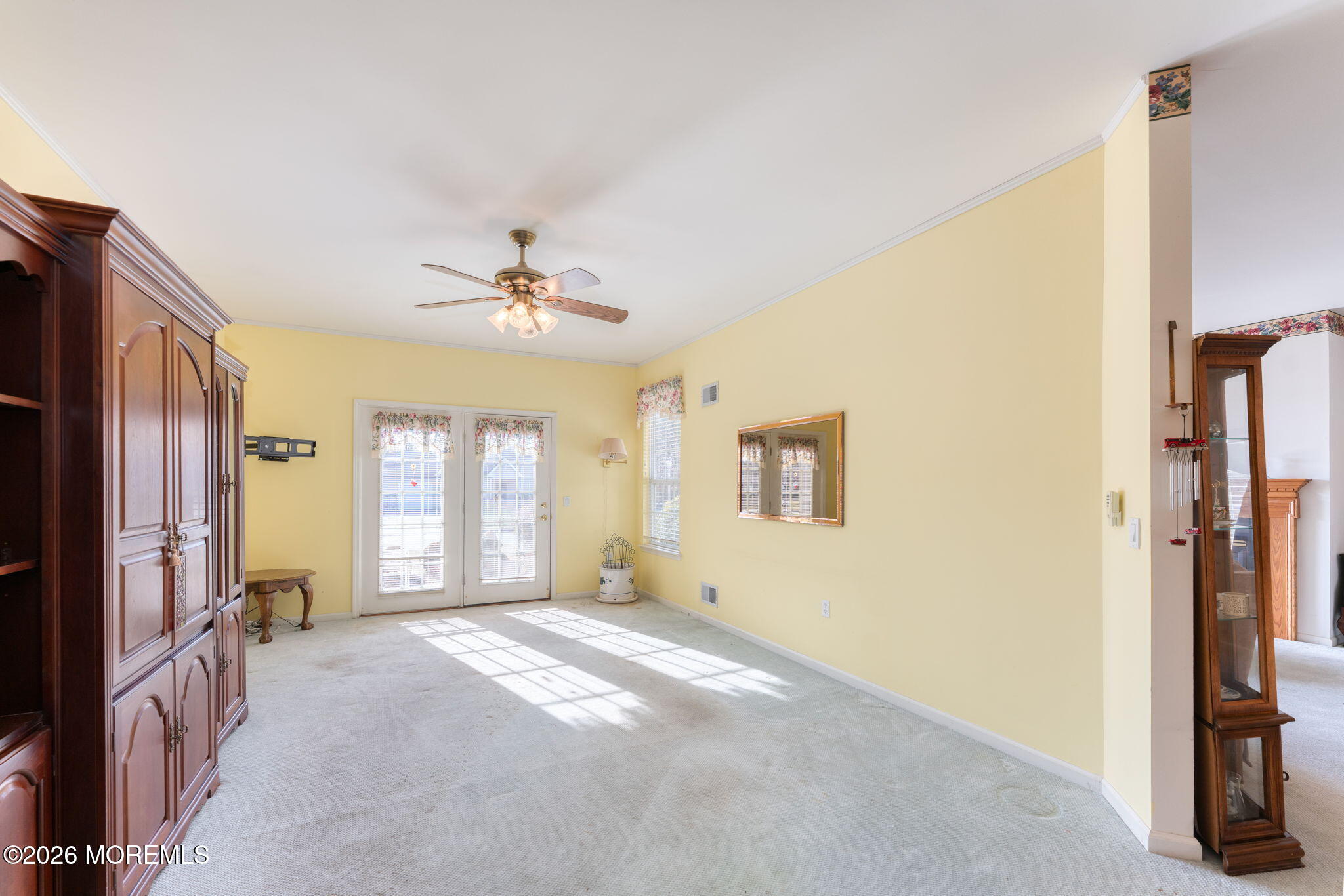 22 Foxwood Road Lakewood, NJ 08701 - Photo 13 of 35 a view of a livingroom with a ceiling fan and window
