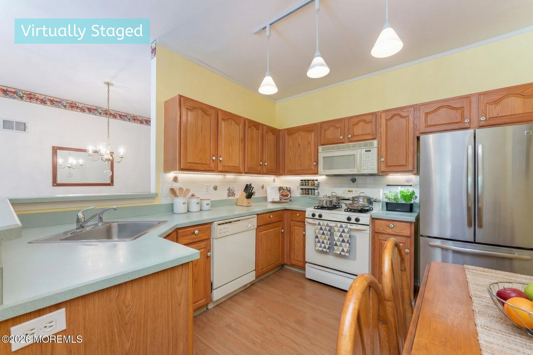 22 Foxwood Road Lakewood, NJ 08701 - Photo 16 of 35 a kitchen with stainless steel appliances granite countertop a sink stove and refrigerator