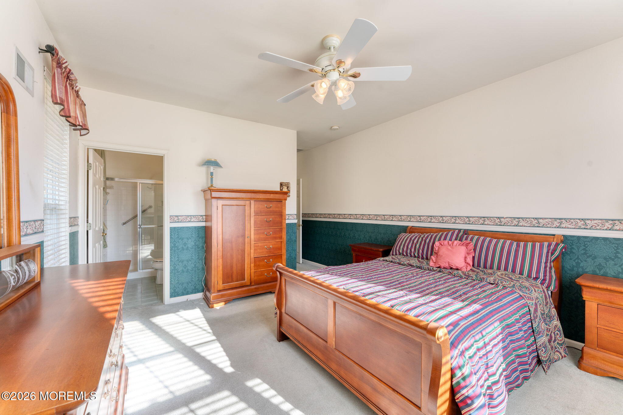 22 Foxwood Road Lakewood, NJ 08701 - Photo 19 of 35 a bedroom with a large bed and chandelier