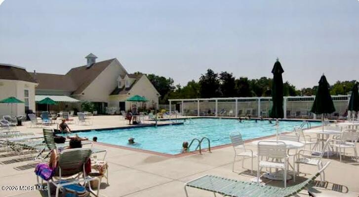 22 Foxwood Road Lakewood, NJ 08701 - Photo 34 of 35 a view of a house with backyard porch and furniture