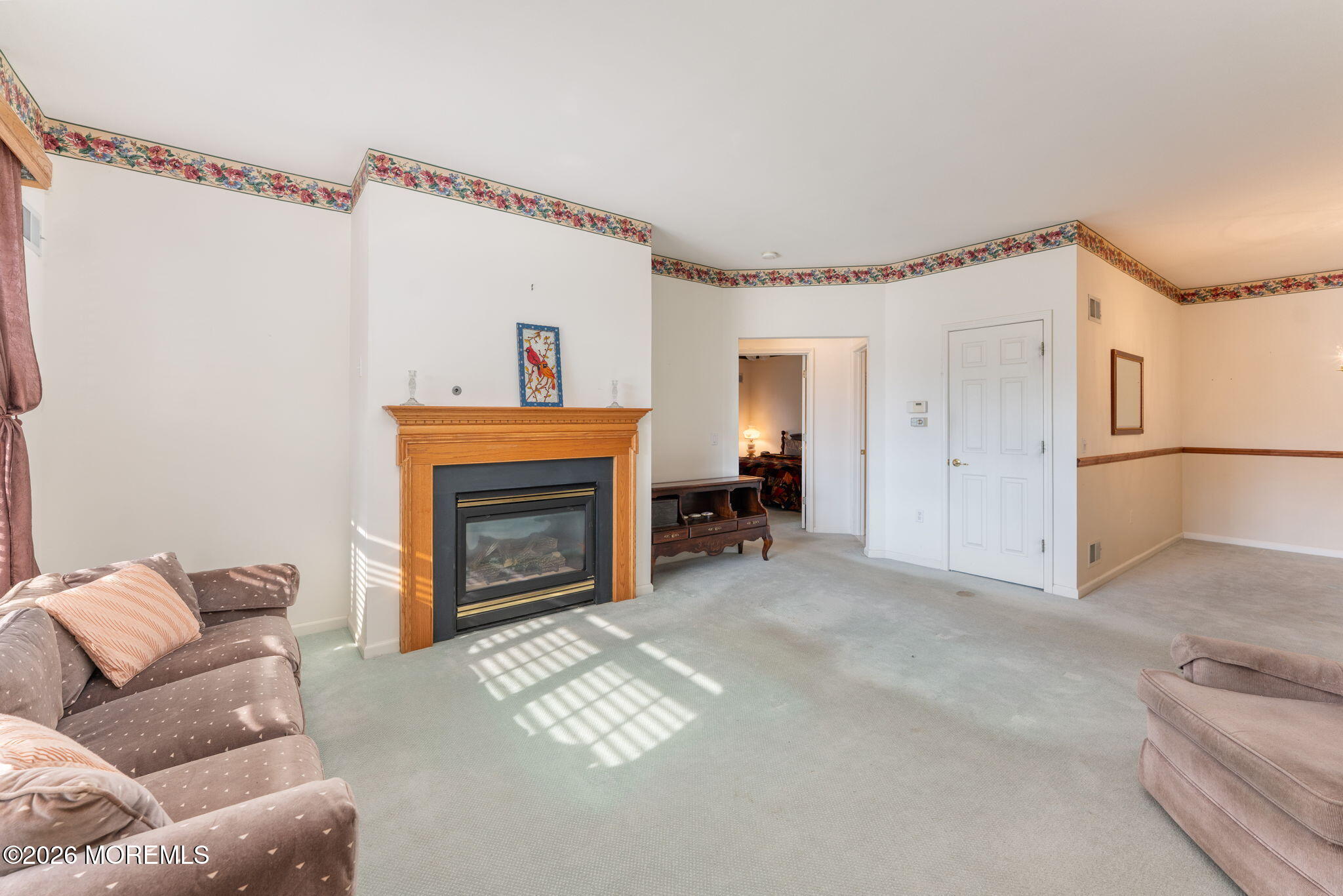 22 Foxwood Road Lakewood, NJ 08701 - Photo 6 of 35 a living room with furniture and a fireplace